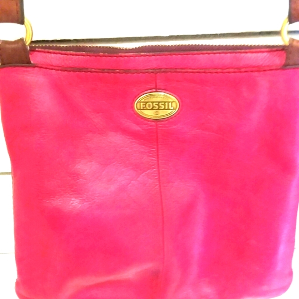 Fossil red berry color crossbody bag.